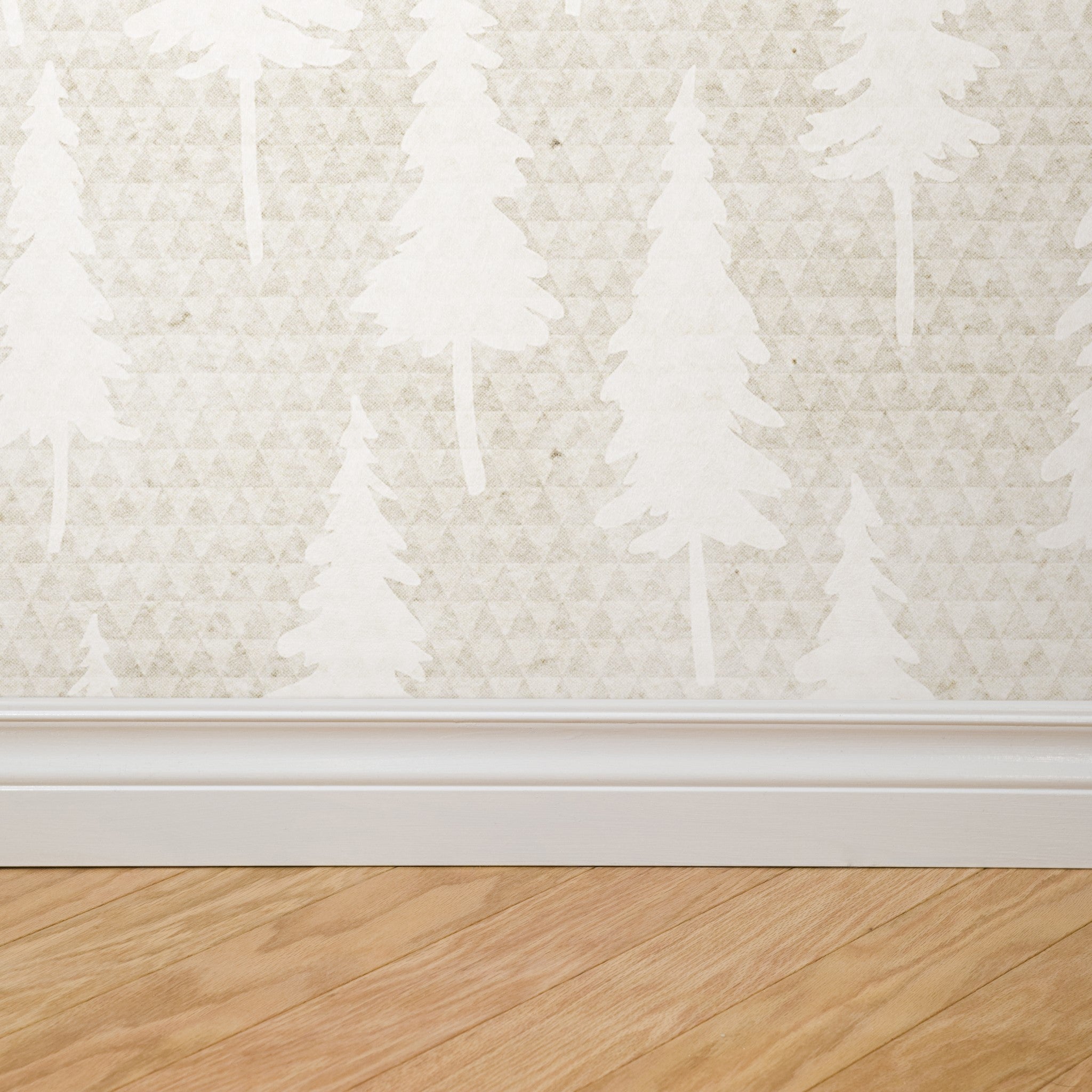 "Wall Blush Wonderland Wallpaper in a stylish living room, highlighting the elegant tree pattern design."