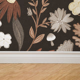 "Mushy (Charcoal) Wallpaper by Wall Blush enhancing a cozy room with elegant botanical design."