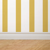 "Wall Blush's Alcott Wallpaper in a modern room with yellow and white stripes creating a chic focal point."