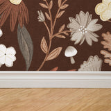 Alt: "Mushy (Maroon) Wallpaper by Wall Blush installed in a cozy living room, focusing on the elegant floral design."