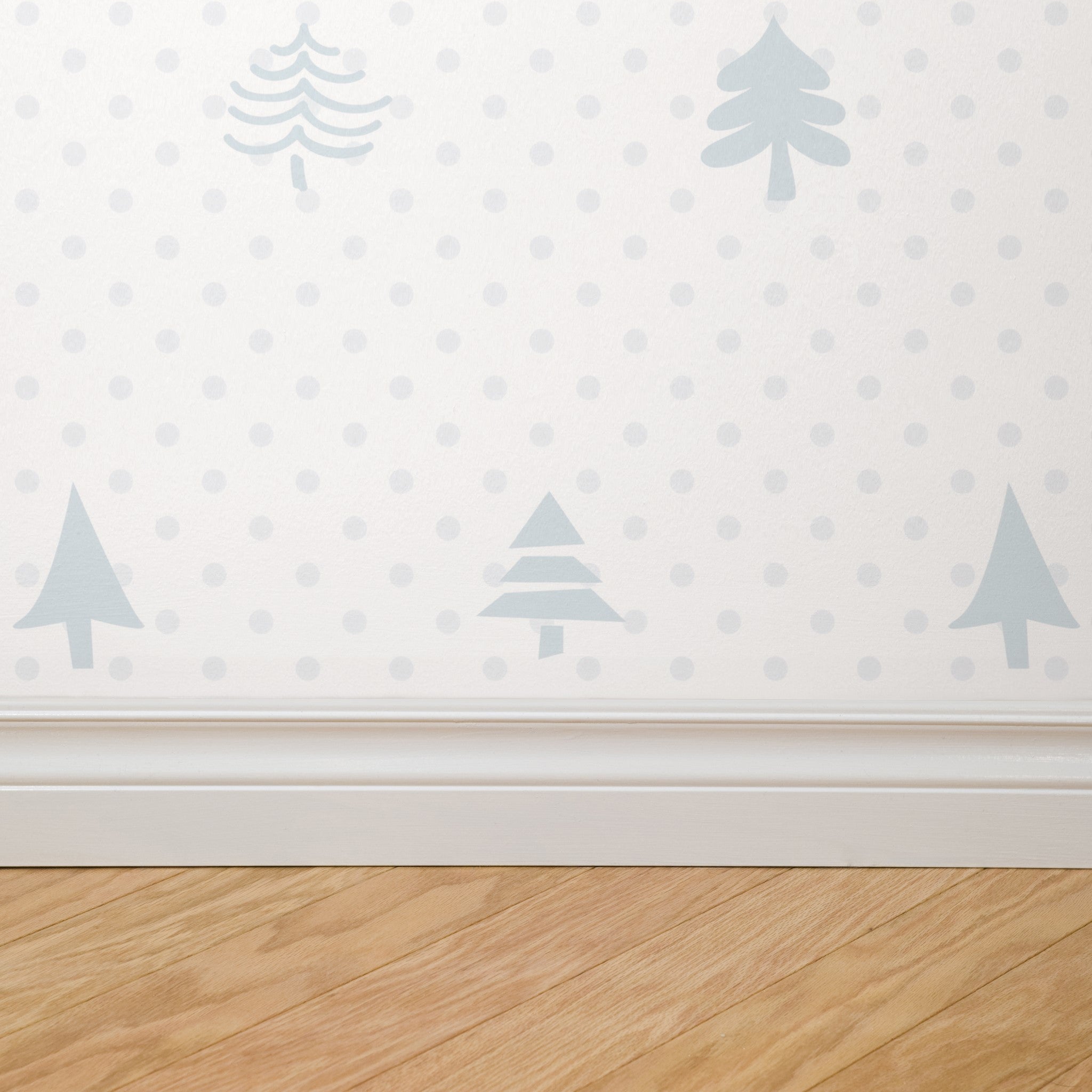 Alt text: "Elegant Noble Wallpaper by Wall Blush with pine tree design in a minimalist style living room, highlighting the serene decor."
