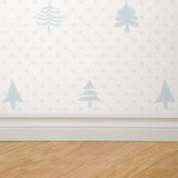 Alt text: "Elegant Noble Wallpaper by Wall Blush with pine tree design in a minimalist style living room, highlighting the serene decor."