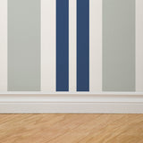 "Crue Wallpaper by Wall Blush with striped pattern in a modern living room interior, accent wall focus."