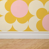 "Wall Blush 'Good Day Sunshine Wallpaper' in modern living room, bright bold pattern detail, decor focus."
