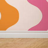 "Wall Blush Polly Wallpaper featuring colorful design in a modern living room, highlighting vibrant wall decor."