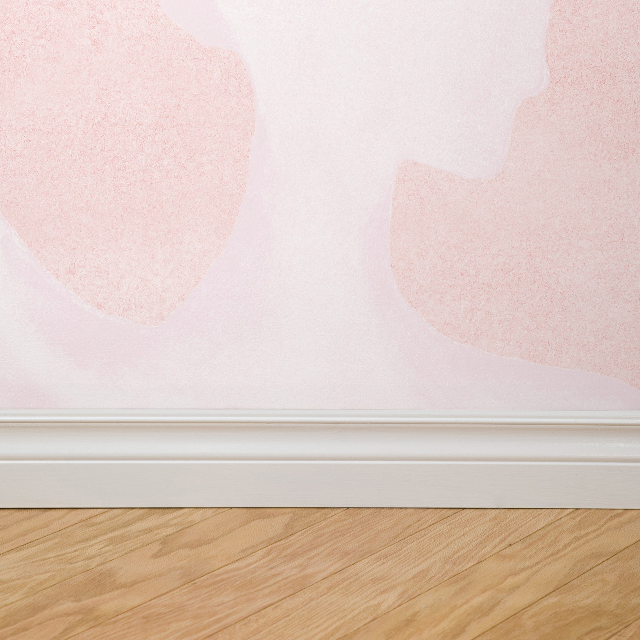 "Pirouette Pattern Edition Wallpaper by Wall Blush installed in a modern room, focus on pink patterned wall decor."