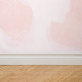 "Pirouette Pattern Edition Wallpaper by Wall Blush installed in a modern room, focus on pink patterned wall decor."