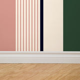 "Wall Blush's Mitzy Wallpaper showcased in modern room setting with prominent stripes for striking wall focus."