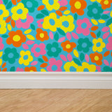 "Bright floral Gabi Wallpaper by Wall Blush in a modern living space, highlighting bold colors and design."