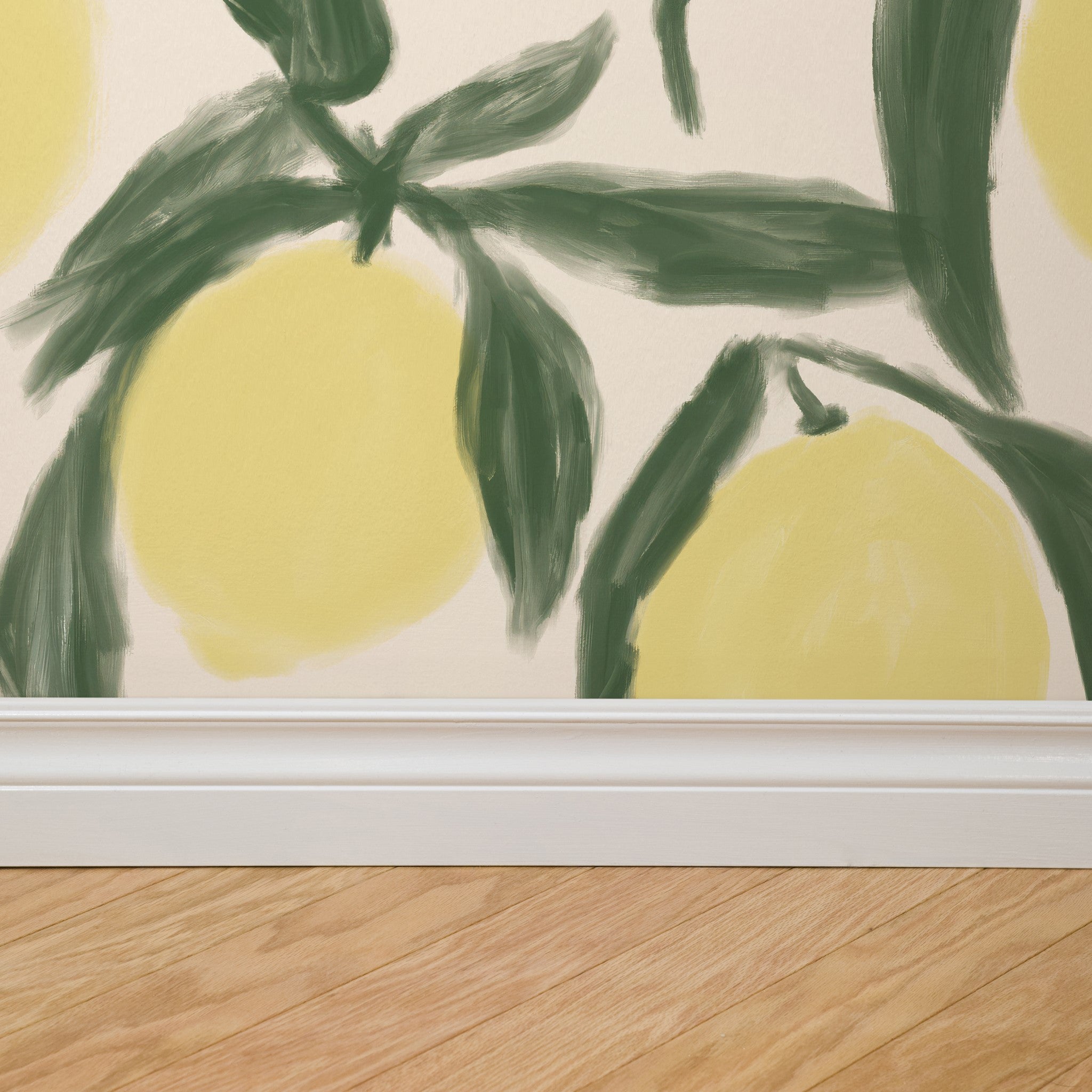 "Wall Blush's Zesty Wallpaper in a modern room, vibrant lemon pattern with green leaves, focus on detail and texture."