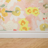 "Floral Susan Wallpaper by Wall Blush adding a vibrant touch to a modern living room interior."