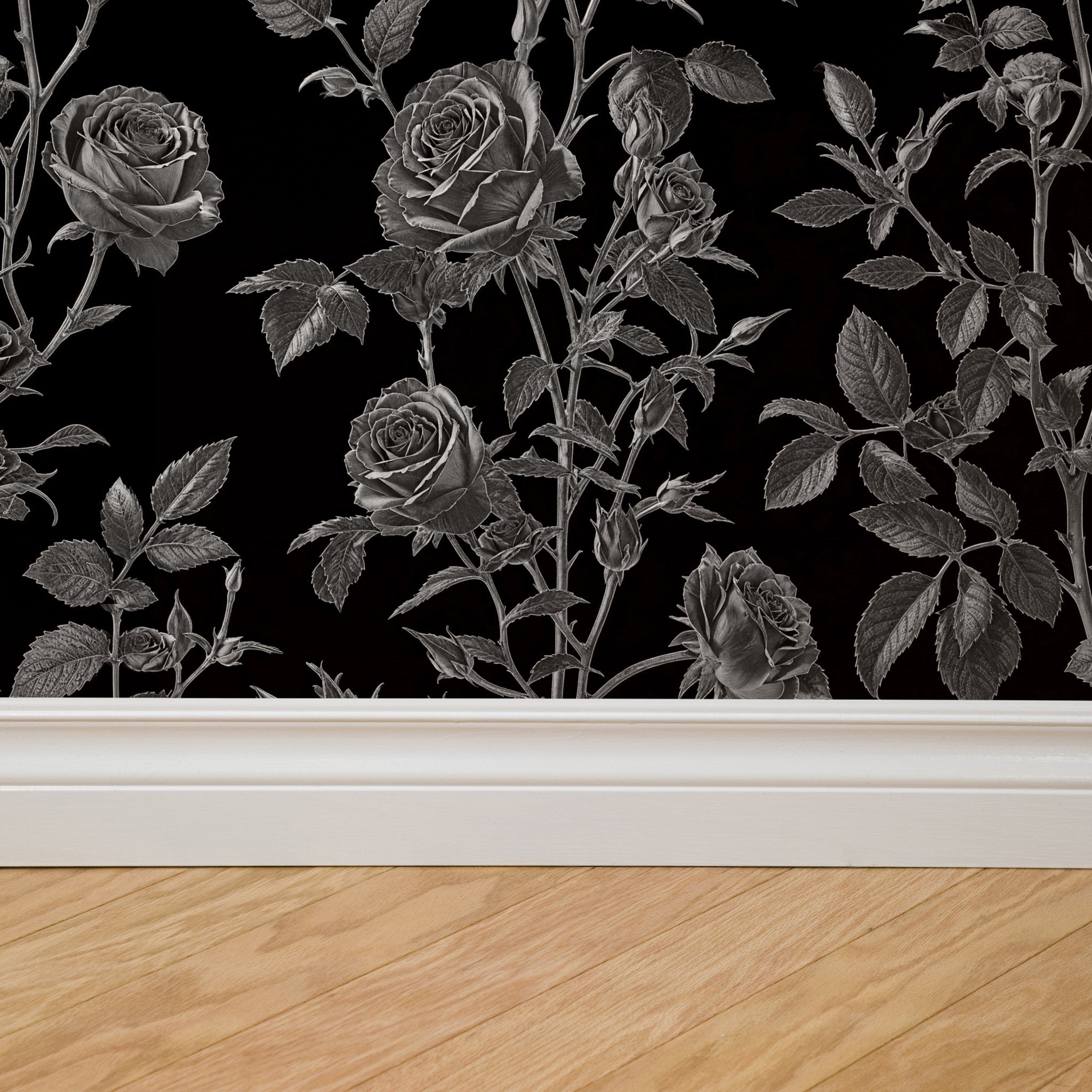 Alt: "Bellatrix Wallpaper by Wall Blush, elegant black floral design featured in a modern room setup, focusing on the detailed pattern."