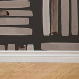 "Dewey (Dark) Wallpaper by Wall Blush in a modern room, showing brush strokes design as the focal point."