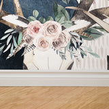 "Wall Blush's Lawless Rose Wallpaper installed in a modern living room, with floral and bird patterns as focal point."