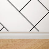 "Wall Blush's Check Mate Wallpaper in modern living room, geometric design focus, elegant interior decor."