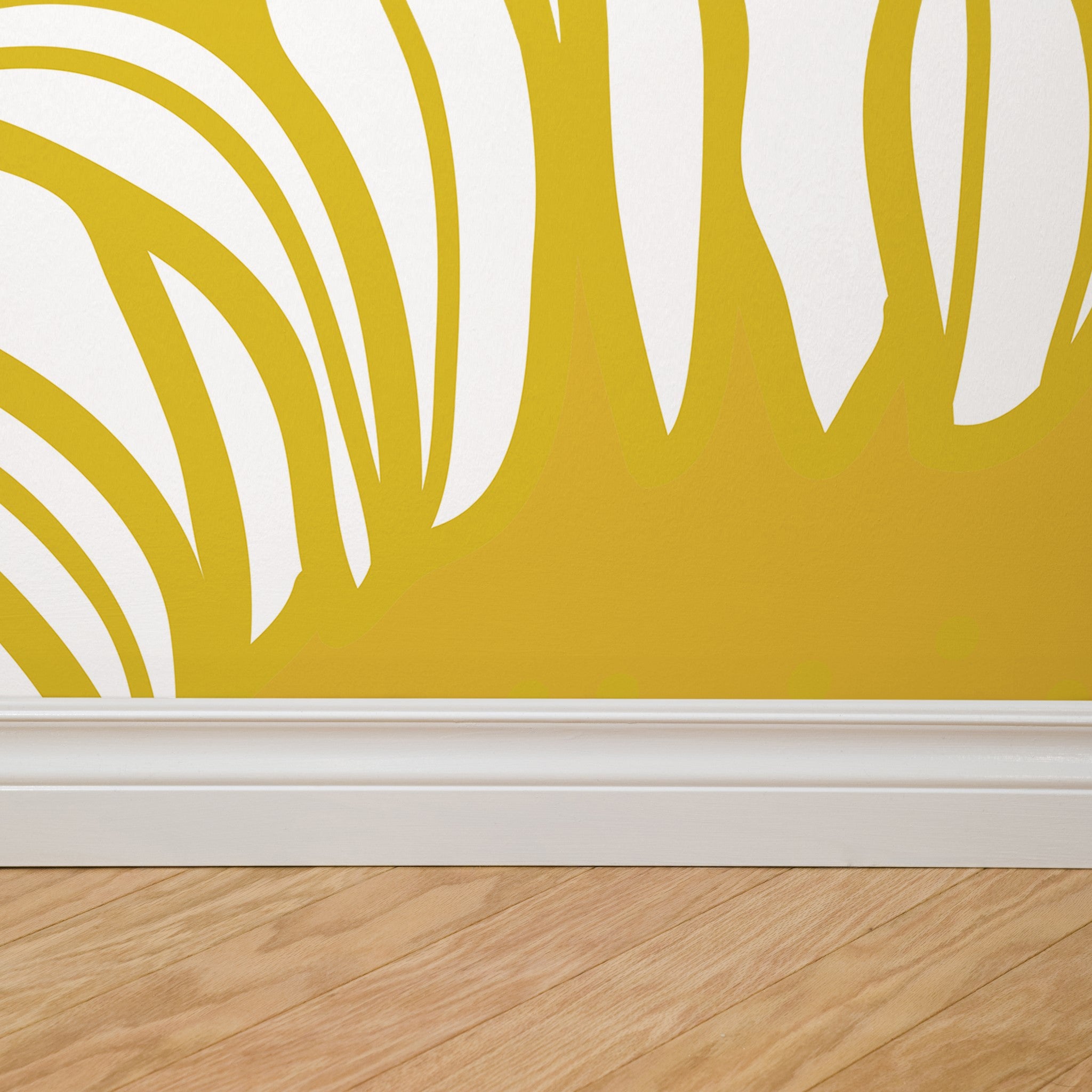 "Penelope Wallpaper by Wall Blush in a living room, featuring bold yellow and white design, enhancing the wall focus."