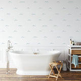 "Waves of Blue wallpaper by Wall Blush enhancing a serene bathroom decor with stylish nautical theme."