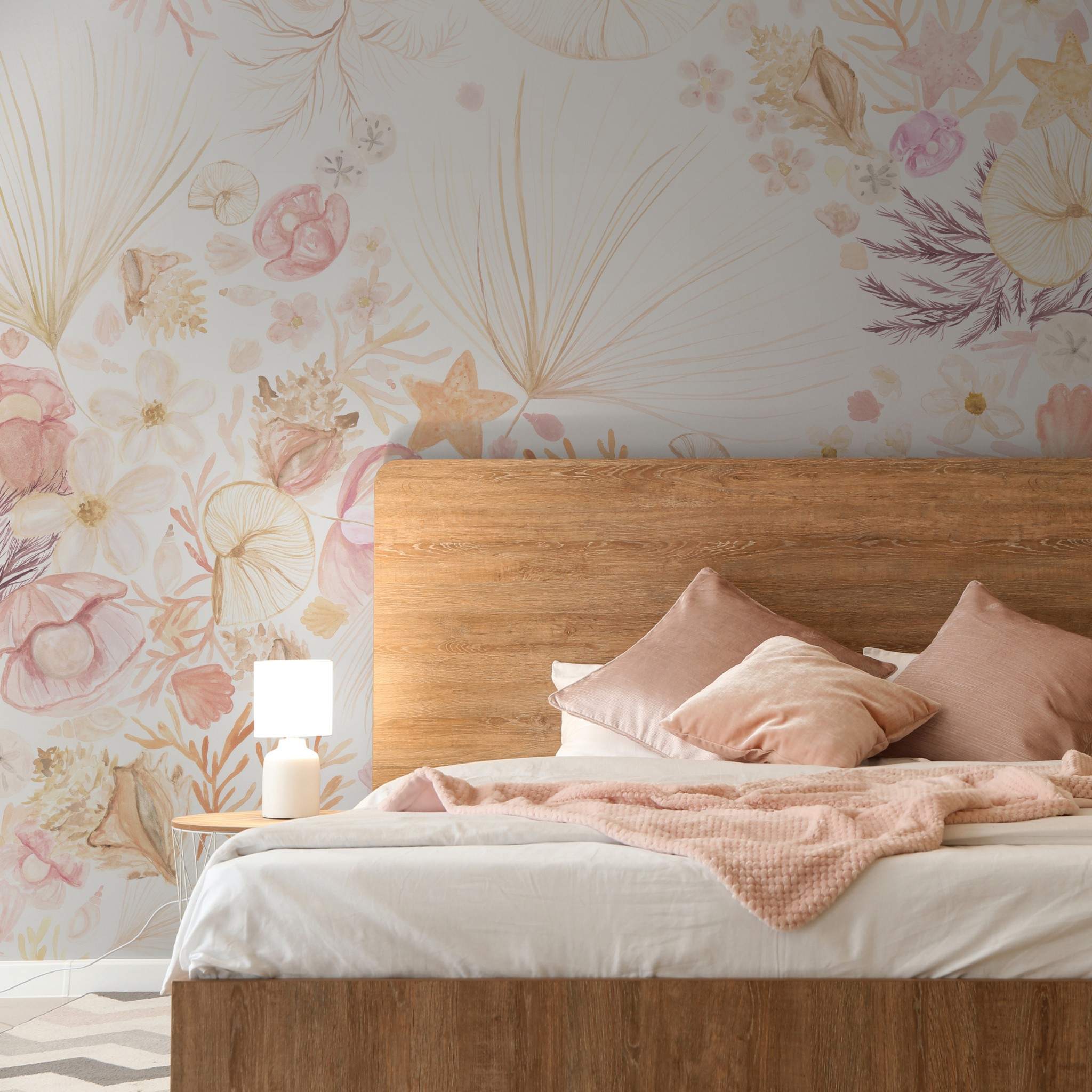 "Beachy Keen Wallpaper by Wall Blush enhancing a cozy bedroom, showcasing the floral design focus."