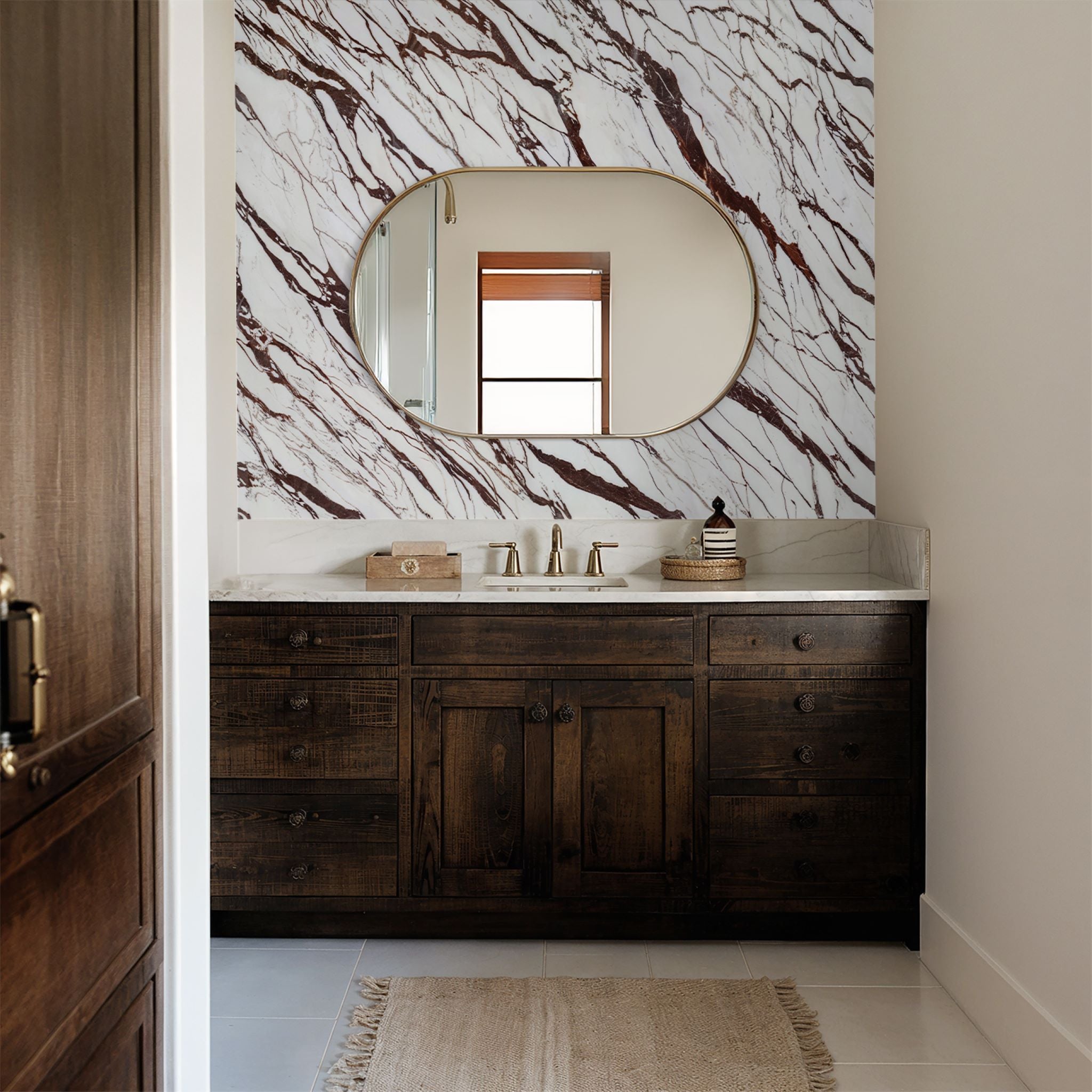"Calacatta Wallpaper by Wall Blush featured in elegant bathroom, enhancing the decor with luxurious marble pattern."