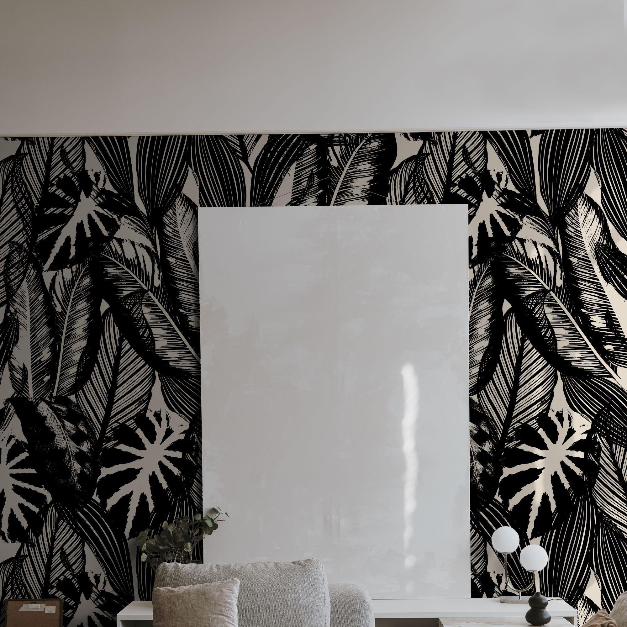 Chloe Wallpaper from The Stefanie Bloom Line in a modern living room, showcasing bold leaf patterns.
