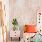 "Coral Cascades Wallpaper by Wall Blush in a stylish bedroom, featuring elegant and subtle pink tones on the walls."
