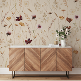 Alt text: "Wall Blush 'Dahlia (Tan) Wallpaper' in a modern living room, accentuating the space with floral elegance."