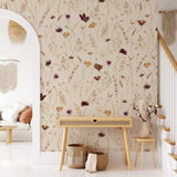 Elegant Wall Blush 'Dahlia (Tan) Wallpaper' in a modern home entryway with decorative accent furniture.