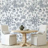 "Wall Blush's Denim Fields Wallpaper in a stylish dining area, featuring botanical prints and soft decor."
