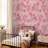 "Dream House Wallpaper by Wall Blush in a child's bedroom highlighting colorful house patterns"