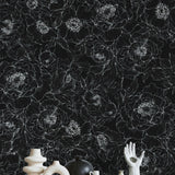 The Dutchess (Black) Wallpaper by The Ania Zwara Line in a modern living room, featuring artistic decor.
