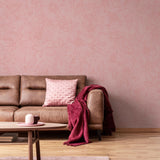 The Dutchess (Pink) Wallpaper by The Ania Zwara Line in a cozy living room setting.
