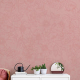 The Dutchess (Pink) Wallpaper by The Ania Zwara Line in an elegantly decorated living room with floral pattern focus.
