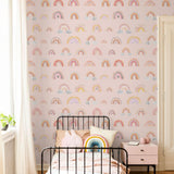 Eden's Rainbows Wallpaper by Wall Blush in a stylish child's bedroom, highlighting the colorful wall decor.

