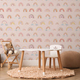 Wall Blush's Eden's Rainbows Wallpaper in a cozy children's bedroom, accentuating the playful decor.
