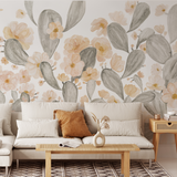 "Sedona Blooms Wallpaper by Wall Blush in cozy living room, featuring floral cactus design with sofa and coffee table."