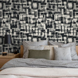 "Ezra Wallpaper by Wall Blush in a modern bedroom, featuring a bold black and white patterned wall."