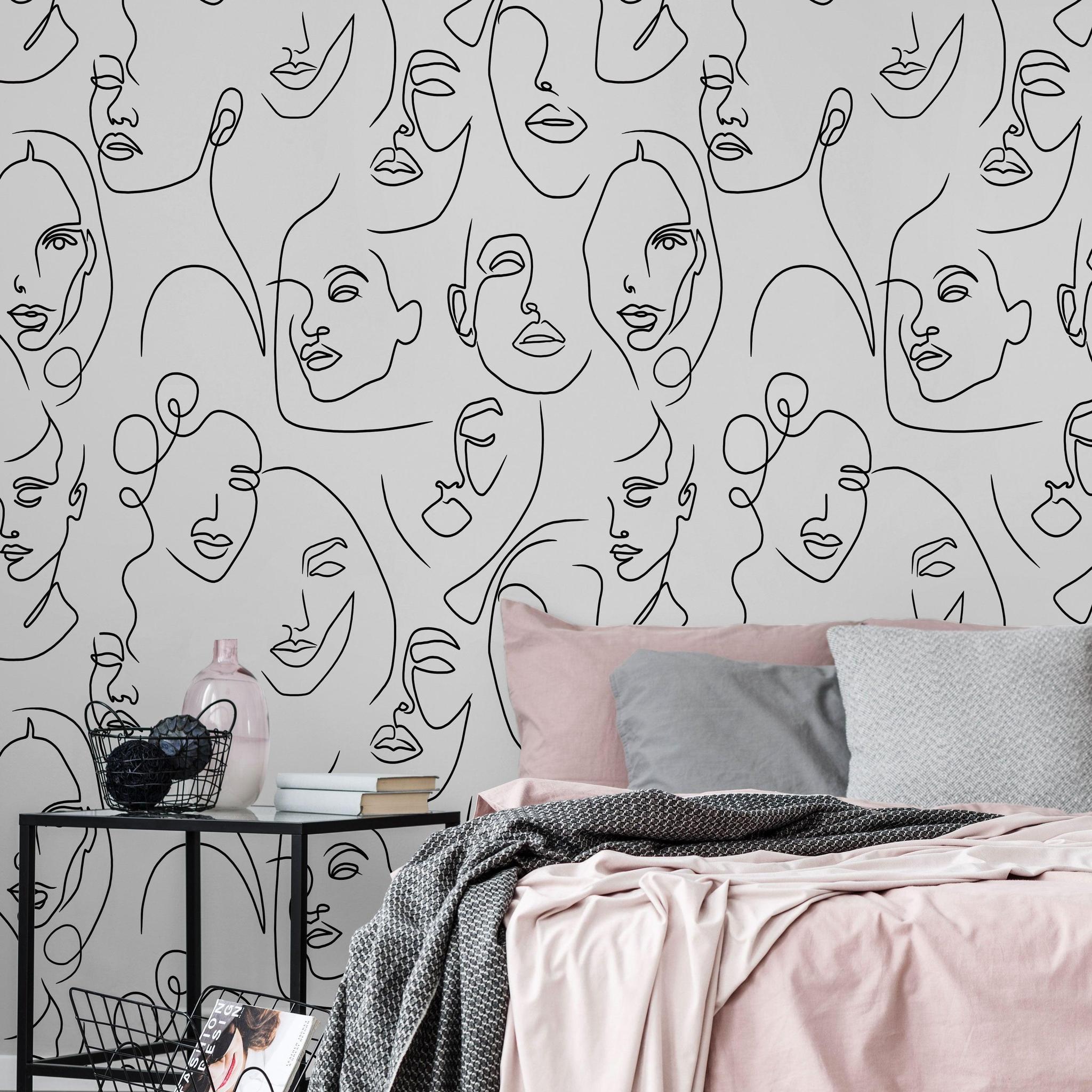 Bella Donna design from Wall Blush AW01 as bedroom wallpaper, with artistic face illustrations.
