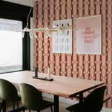 "Felicity Wallpaper by Wall Blush enhancing dining room decor with bold geometric patterns and vibrant colors."