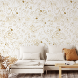 "Wall Blush Golden Hour Wallpaper in a cozy living room setting, with floral design as the main focus."
