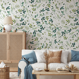 "Green Valley Wallpaper by Wall Blush in a cozy living room, highlighting floral design and vibrant wall focus."