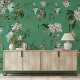 "The Grove Wallpaper by Wall Blush in a modern living room, with vibrant botanical design as the focal point."