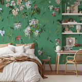 "The Grove Wallpaper by Wall Blush in cozy bedroom, highlighting vibrant floral design and decor accents."
