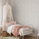 "Lauria Wallpaper by Wall Blush in a cozy bedroom, highlighting elegant wall design focus."
