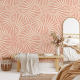 "Lena Wallpaper by Wall Blush in a cozy bedroom, showing a stylish, pink, geometric pattern focus."