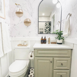 "Lined Meadow Wallpaper by Wall Blush showcased in a stylish, modern bathroom, emphasizing elegant wall decor."