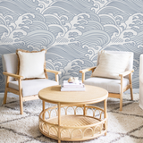 Nalu Wallpaper by Wall Blush featured in stylish living room with cozy seating area.
