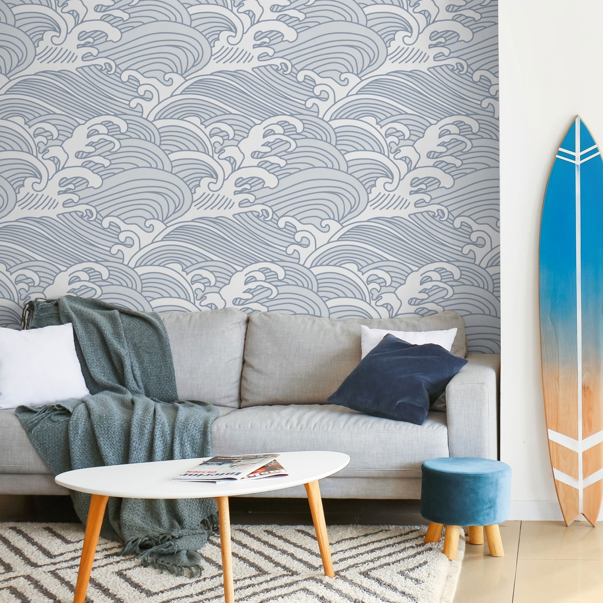 "Nalu Wallpaper by Wall Blush in a stylish living room, showcasing wave design as the focal point."