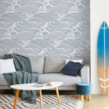 "Nalu Wallpaper by Wall Blush in a stylish living room, showcasing wave design as the focal point."
