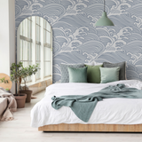 "Nalu Wallpaper by Wall Blush in a cozy bedroom with wave pattern focusing on modern home decor."