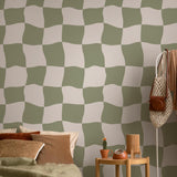 Nelly Wallpaper by Wall Blush SG02 in a cozy bedroom, with a focus on the stylish green and beige pattern.
